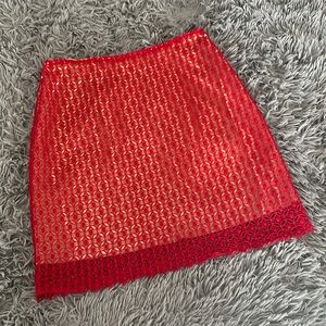 Women’s skirt. Red lace with tan silky underlay. Size M